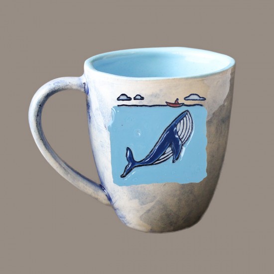 A whale and a boat mug bell