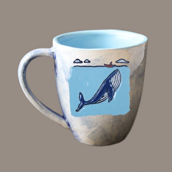 A whale and a boat mug bell